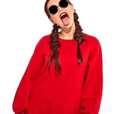 young happy smiling woman model with bright makeup and colorful lips with two horns and sunglasses in summer red clothes isolated on white. Going crazy and showing her tongue