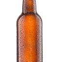 Cold bottle of beer with drops isolated on white background.